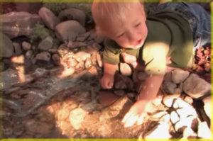 Kid playing in Landscape Water Feature